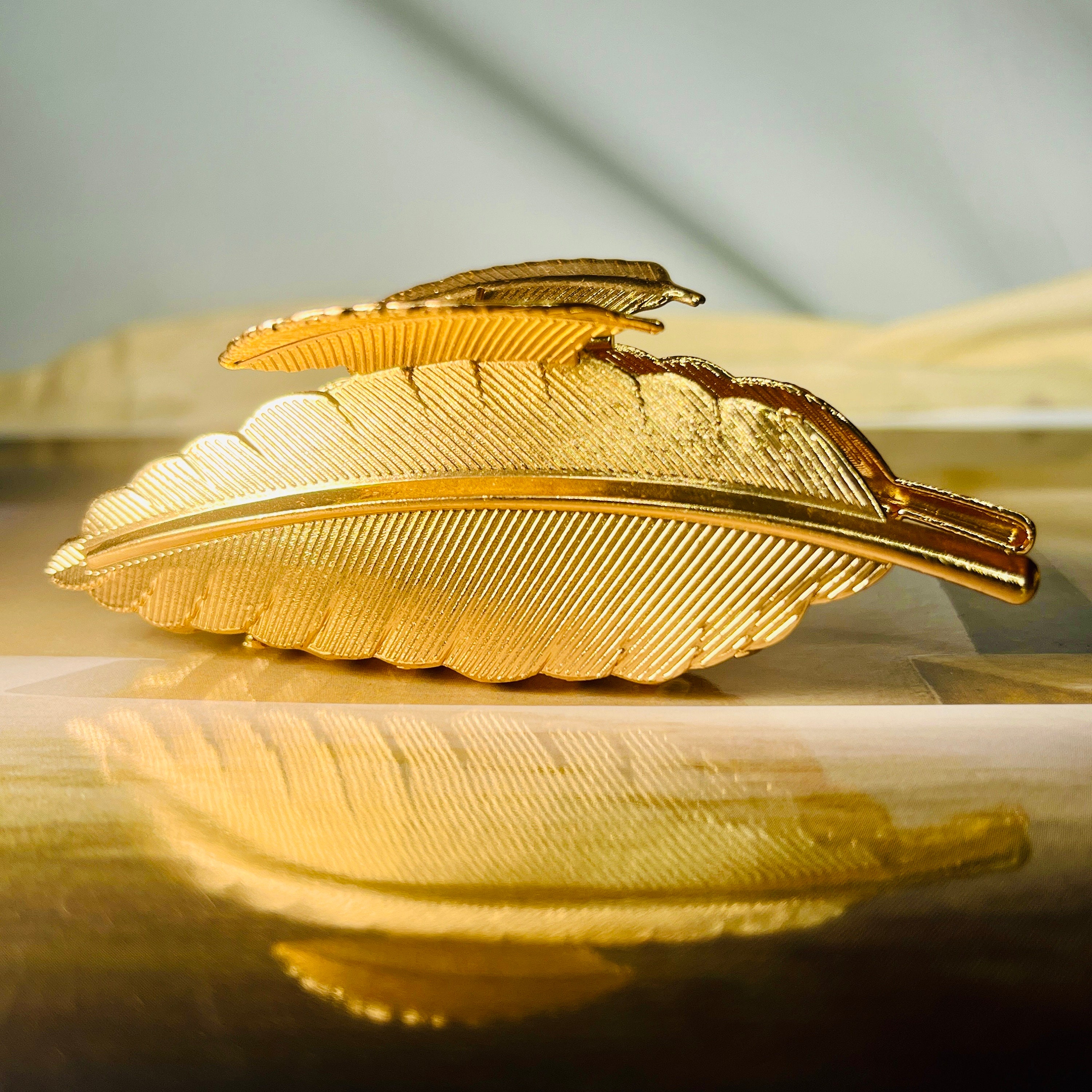 Gold hair brooch discount