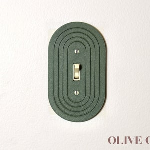 Sleek Minimalist Oval Light Switch Cover Plate image 1