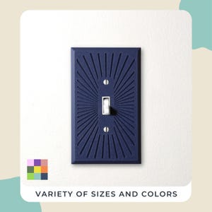 May include: A navy blue light switch cover featuring a sunburst pattern. The white switch is set against a white wall. The text "VARIETY OF SIZES AND COLORS" is displayed at the bottom of the image.