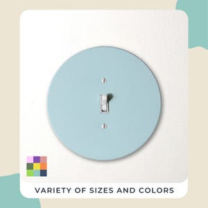 May include: A light blue, round light switch cover with a toggle switch. The cover is mounted on a white wall. The text "VARIETY OF SIZES AND COLORS" is at the bottom, along with a color palette.