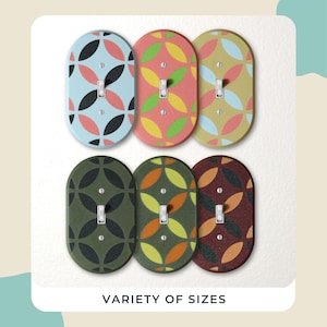 May include: Six oval light switch covers with colourful geometric patterns. The patterns include blue, pink, green, yellow, and black. The text "VARIETY OF SIZES" is at the bottom of the image.