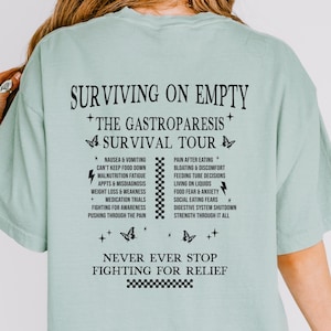 空腹でも生き延びる胃不全麻痺サバイバルツアーシャツ 胃不全麻痺啓発Tシャツ 運動性消化管障害 希少疾患 慢性疾患 ギフト