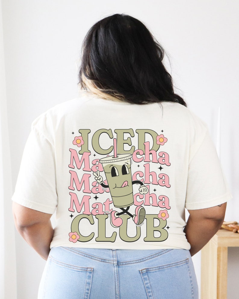 May include: A white t-shirt with a green cartoon illustration of a cup of iced matcha with the text "ICED Matcha CLUB" in green and pink letters.