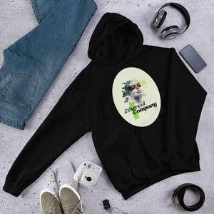 Könnte beinhalten: Schwarzer Kapuzenpullover mit einem weißen ovalen Grafik, das ein Frauen Gesicht mit grünem Laub und den Text "Ethereal Company" in Grün und Schwarz zeigt.