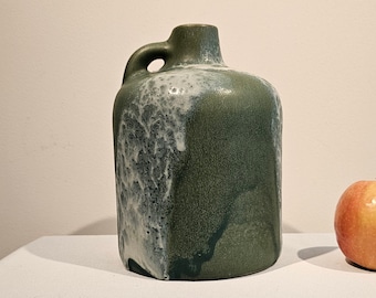 A West German Fat Lava jug made by Otto Keramik. The jug is green with white lava.