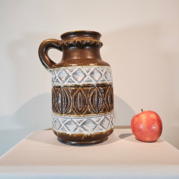 A West German Fat Lava vase made by Bay keramik. The vase is brown and white and is numbered: 93 25. Bodo Mans design.