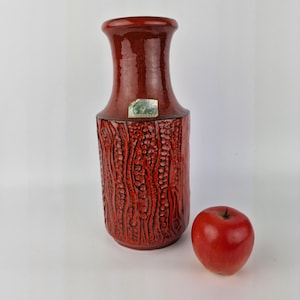A West German Fat Lava vase made by Carstens Tonnieshof. The vase is red and is numbered: 7650-30.