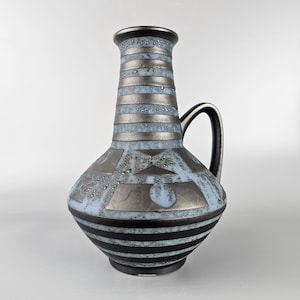 A West German Fat Lava vase made by Carstens Tonnieshof. The vase is blue and black (Ankara design) and is numbered: 1507-27.