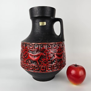 A West German Fat Lava vase made by Carstens Tonnieshof. The vase is red and black and is numbered: 158-30.