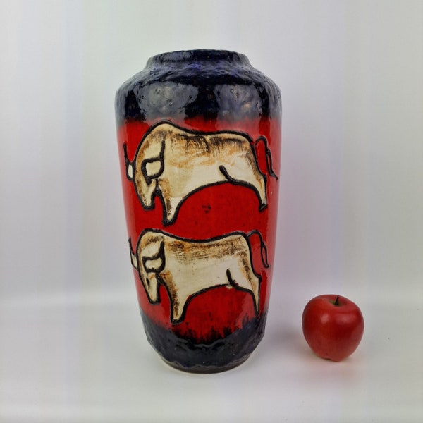 A beautiful West German Fat Lava vase made by Scheurich. The vase is blue and red with bulls and is numbered: 517-38.