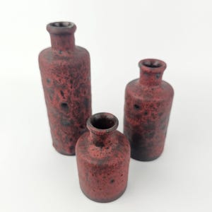 Set di tre vasi Fat Lava vintage della Germania Ovest, realizzati da Ruscha. Colori: rosso scuro. WGP / MCM / 1970. Numeri di stampo 811-1, 811-2 e 811-3.