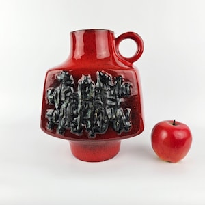 A West German Fat Lava vase made by Walter Gerhards. The vase is red and black and is numbered: 720/25.
