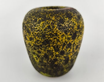 A West German Fat Lava vase made. The vase is dark brown with yellow lava glaze. Signed but maker unknown.