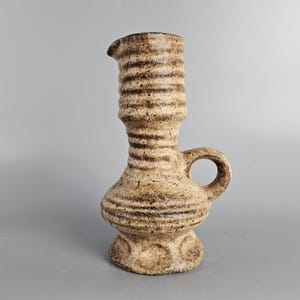 A beautiful vintage vase / jug made by &quot;Vest Keramiek&quot; / &quot;van Woerden&quot;, Gouda, Holland. Beige lava and model number J7.