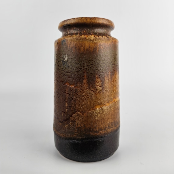 A West German Fat Lava Vase by Scheurich. the Vase is A West German Fat Lava Vase by Scheurich. the Vase is
