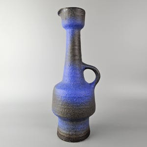 A beautiful vintage vase made by &quot;Vest Keramiek&quot; / &quot;van Woerden&quot;, Gouda, Holland. Dark blue clear glaze. Model number K40.