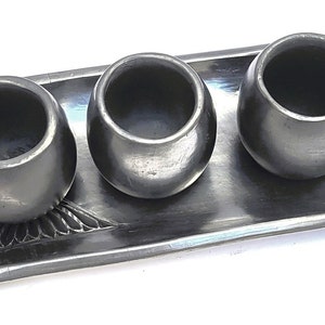 Handcrafted Barro negro Mexican shot glasses w/ handmade and etched serving tray. Made of natural black clay from Oaxaca, MX item # GTL10025