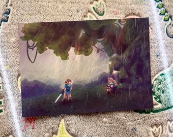 May include: A rectangular art print depicting a scene in the rain with a character holding a sword standing on a grassy hill near a seated figure under a large green tree. The illustration features muted tones of green, blue, and purple throughout.