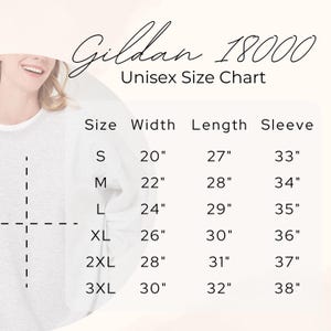 May include: A size chart for the Gildan 18000 unisex sweatshirt, with measurements in inches. Sizes range from S to 3XL, detailing width, length, and sleeve dimensions. The chart is displayed on a light background.