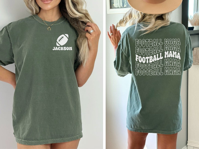 May include: A green t-shirt with a white football and the name "JACKSON" on the front. The back of the shirt has the text "FOOTBALL MAMA" repeated five times in a retro font.