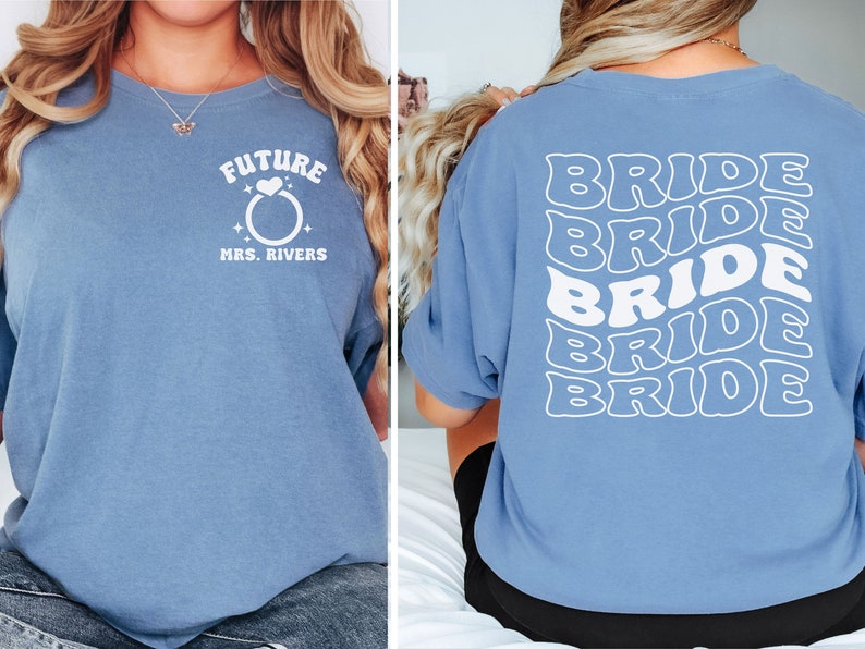 May include: Two blue t-shirts with white text. The first shirt says "Future Mrs. Rivers" with a ring and heart graphic. The second shirt says "Bride" five times in a stacked, wavy font.