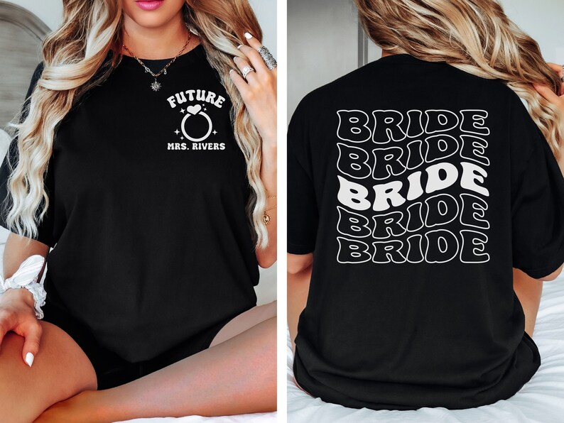 May include: Black t-shirt with white text. The front of the shirt says "Future Mrs. Rivers" with a ring and heart graphic. The back of the shirt says "Bride" five times in a wavy, stacked design.