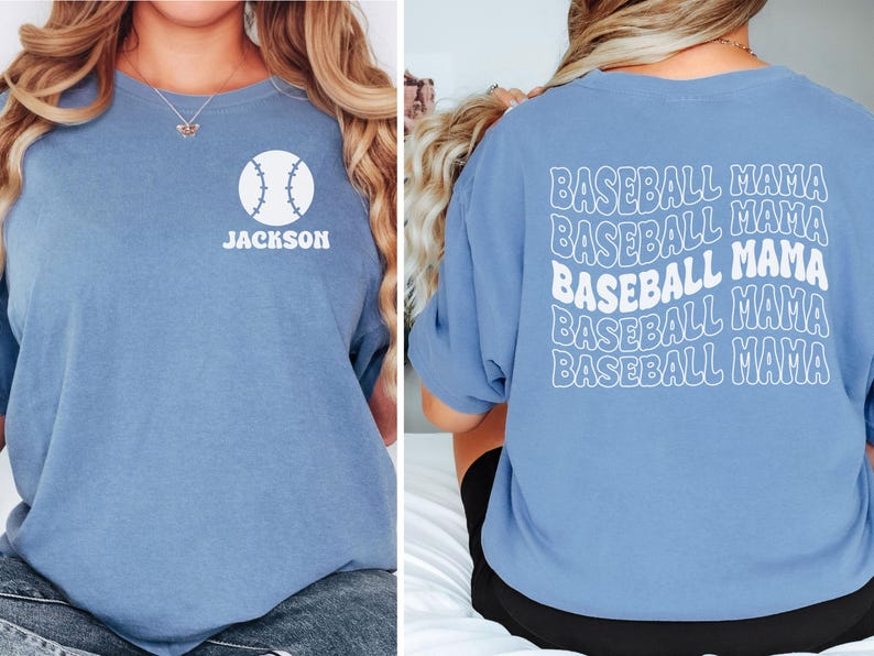 May include: A blue t-shirt with a white baseball graphic and the name "Jackson" on the front. The back of the shirt has the phrase "Baseball Mama" repeated five times in a retro font.