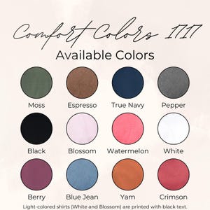 May include: A color chart for Comfort Colors 1717 shirts featuring twelve circular swatches labeled Moss, Espresso, True Navy, Pepper, Black, Blossom, Watermelon, White, Berry, Blue Jean, Yam, and Crimson. Text notes light shirts use black ink.