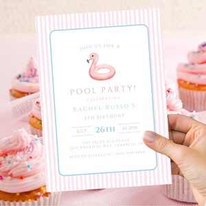 May include: A pink and white striped invitation for a pool party, held on July 26th at 2 PM, featuring a flamingo float illustration. The invitation is held near cupcakes with pink frosting and sprinkles.