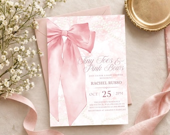 May include: A rectangular baby shower invitation card featuring a large watercolor illustration of a pink satin bow on the left side. The text reads Tiny Toes & Pink Bows, Join us for a baby shower honoring Rachel Russo, Oct 25, 2pm.