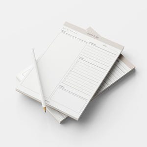 May include: Three rectangular daily plan notepads with a white pencil. The notepads have a light beige header with the words "DAILY PLAN" and "MTWTFSS". Each notepad has sections for priorities, to-do lists, and goals.