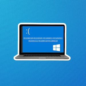 May include: A blue laptop screen displays a blue screen of death error message with the text ":( 01100110 01110101 01100011 01110101 01110111 01101111 01100110 01100110 01110011 01110100 01110010" and the Windows logo.