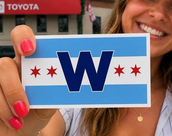 May include: A rectangular sticker featuring a design inspired by the Chicago flag, with two horizontal light blue stripes on a white background. A large dark blue letter W is centered, flanked by two small red six-pointed stars on each side.