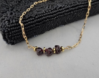 Necklace of Garnet Nuggets, the January Birthstone, paired with Gold Accents on a delicate bar will thrill your New Year Loves