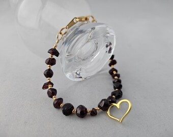 Garnet, the January Birthstone, paired with a Gold Plated Heart and Gold Accents will thrill your New Year Loves