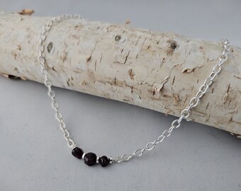 Necklace of Three Garnet Nuggets, the January Birthstone, paired with Silver Accents on a delicate bar will thrill your New Year Loves