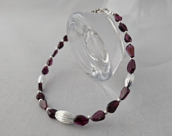 Bracelet of Garnet, the January Birthstone, paired with Silver 'Rice' Accents will thrill your New Year-born Loves