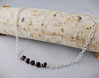 Necklace of Five Garnet Nuggets, the January Birthstone, paired with Silver Accents on a delicate bar will thrill your New Year Loves