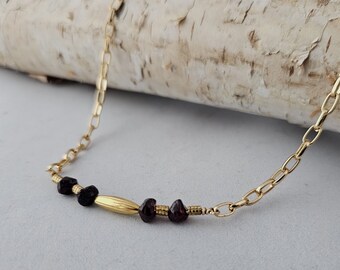 Necklace of Garnet Nuggets, the January Birthstone, paired with Gold Accents on a delicate bar will thrill your New Year Loves