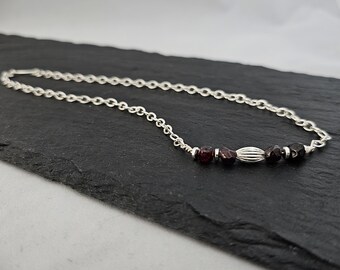 Necklace of Garnet Nuggets, the January Birthstone, paired with a Silver Rice Accent on a delicate bar will thrill your New Year Loves