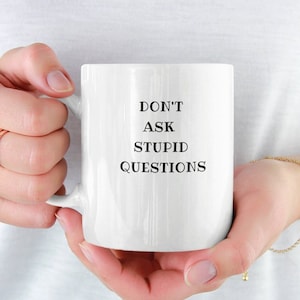 May include: A set of three ceramic mugs with a speckled, matte finish. The mugs are in shades of cream, light gray, and dark gray. Each mug has a simple, minimalist design, perfect for coffee or tea.