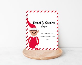 May include: A white sign with a red and white striped border and an elf illustration. The sign reads "Editable Custom Sign" with space to add text and create multiple signs. The sign is 8x10 inches.