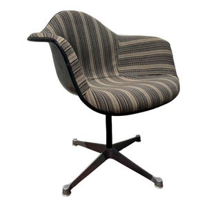May include: A vintage swivel chair with a striped fabric seat in shades of brown, beige, and black. The chair has a black frame and a four-star base. The chair's design features a curved back and armrest.
