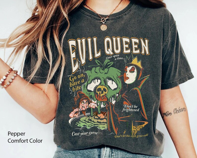 May include: Black t-shirt with a graphic print of the Evil Queen from Snow White. The graphic includes the text "Evil Queen", "Once upon a time", "Go on, have a bite", "Cast your curse", "Don't be frightened", and "Don't let the ash grow cold".
