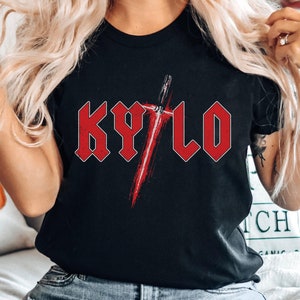 May include: Black t-shirt featuring a red graphic of a lightsaber and the word "KYLO" in red block letters.