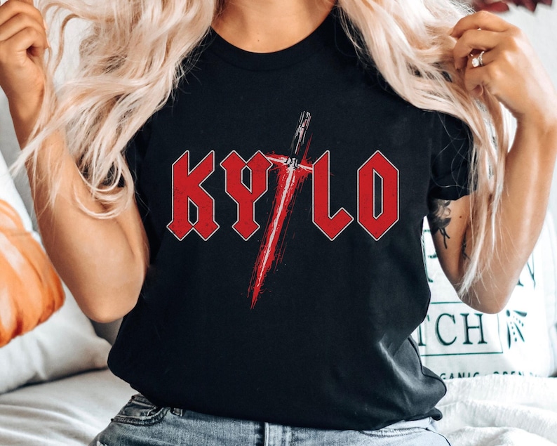 May include: Black t-shirt featuring a red graphic of a lightsaber and the word "KYLO" in red block letters.