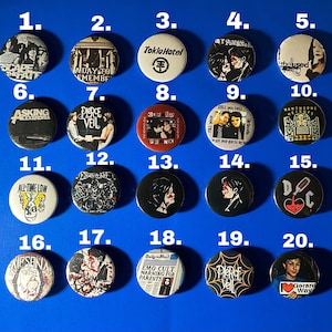 May include: Twenty round, black and white buttons with various band logos and images. The buttons are numbered 1 through 20. Some of the bands featured include My Chemical Romance, All Time Low, and Pierce the Veil.