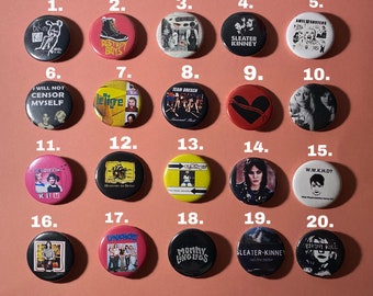 May include: Twenty black and white button pins with various band names and album covers. The pins are numbered 1 through 20.