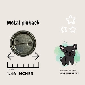 May include: A black and white cartoon illustration of a dog with a pink tongue sticking out. The dog is on a green and blue watercolor background. The image is a 1.46 inch button with a metal pinback. Crafted by Paw @brainfreeze