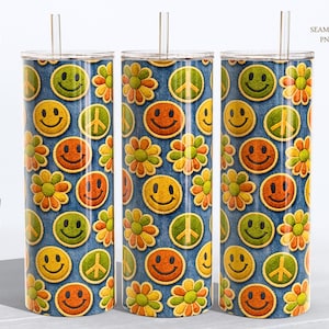 May include: Three stainless steel tumblers with a retro design. The pattern features smiley faces, peace signs, and flowers in yellow, orange, and green on a blue denim background. Each tumbler has a clear straw and lid. The words "DIGITAL DOWNLOAD" are printed vertically on the left.